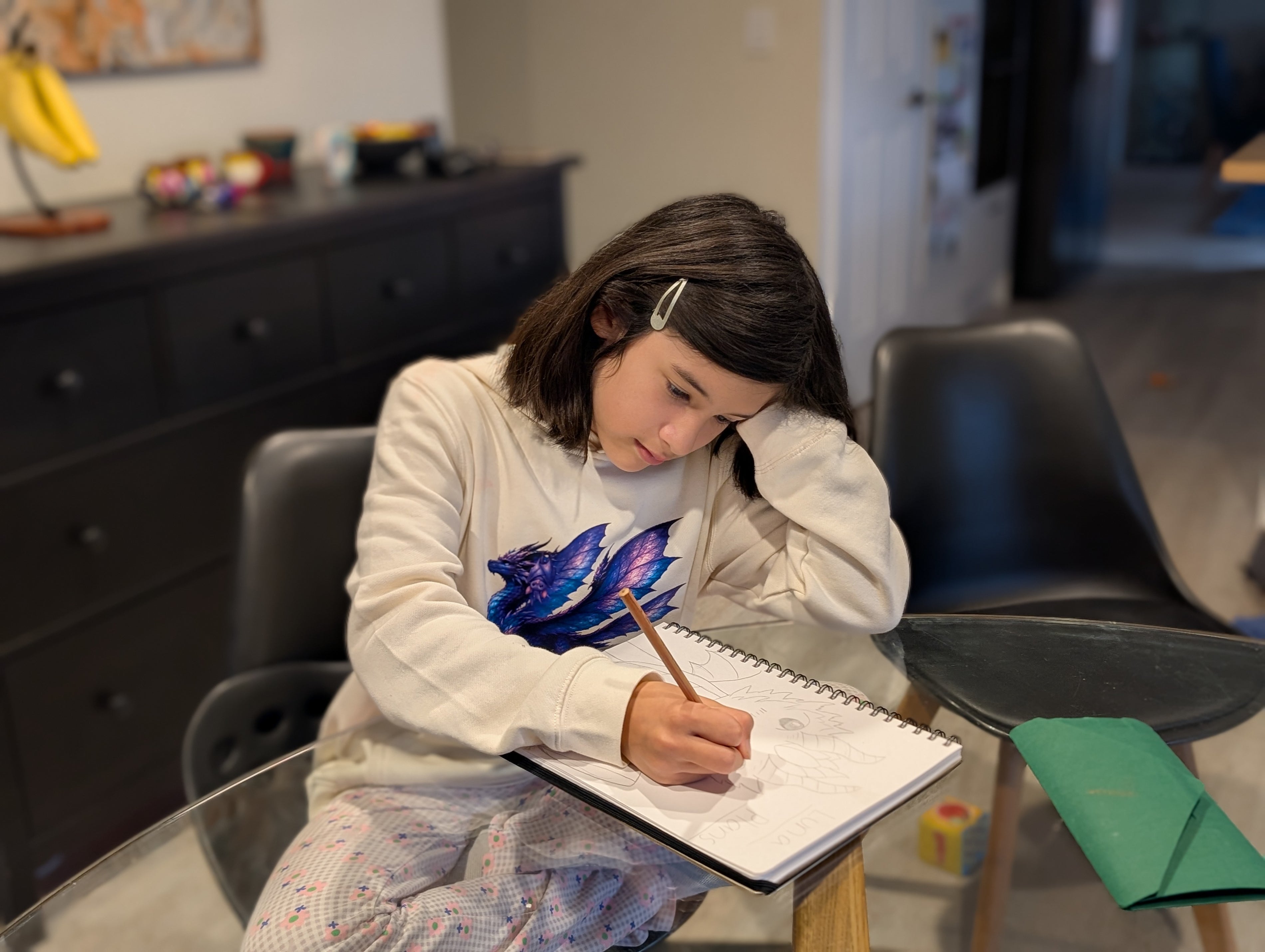 Serena, aged 11, designer of Dragon Buddies, at her desk in Ballarat